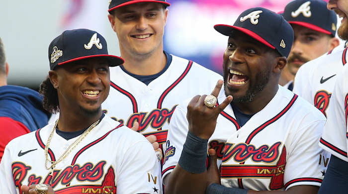 Atlanta Braves second baseman Ozzie Albies (1) and center fielder Guillermo Heredia (38) celebrate after receiving World Series championship rings